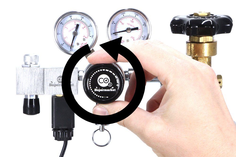 Set output pressure of dual stage regulator